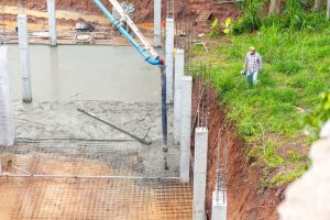Project manager walking around site construction for checking.