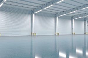 3D illustration. New empty warehouse or factory. Logistics center. Open space